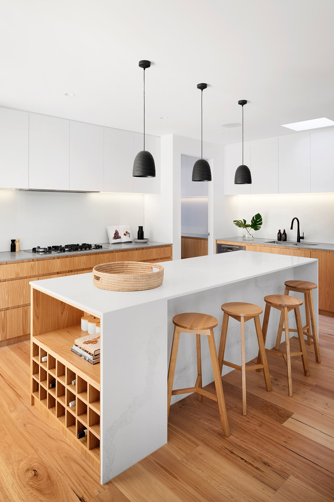 White and wood kitchen design with island